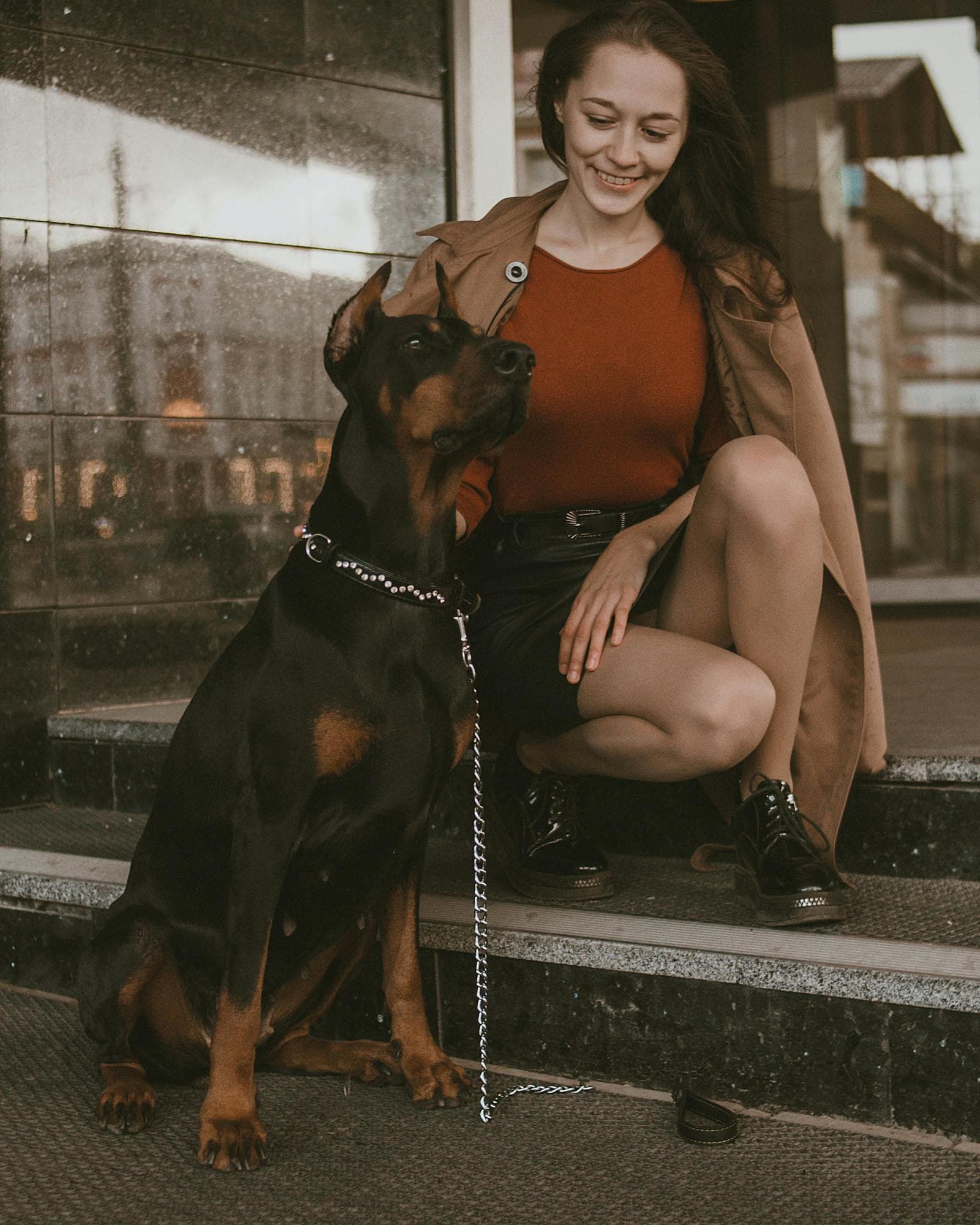 Shiran with a dog — a quiet moment from the studio